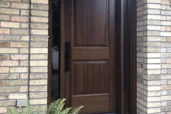 An oak fiberglass door with glaze sidelites installed by Heritage Renovations in London, Ontario, and manufactured by Gentek Entryguard.